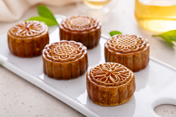 Traditional mooncakes for a Chinese Mid-Autumn Festival or Moon festival served with tea