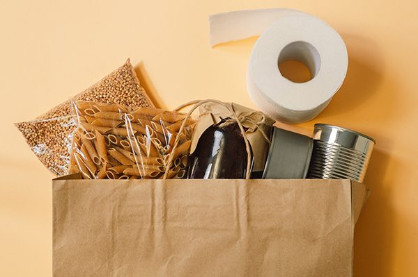 Food delivery, Donation, coronavirus. Buckwheat, pasta, canned food, lentils, toilet paper. View from above