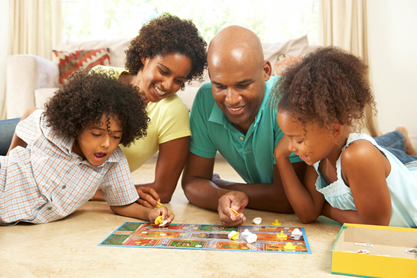 Family playing a favorite board game.